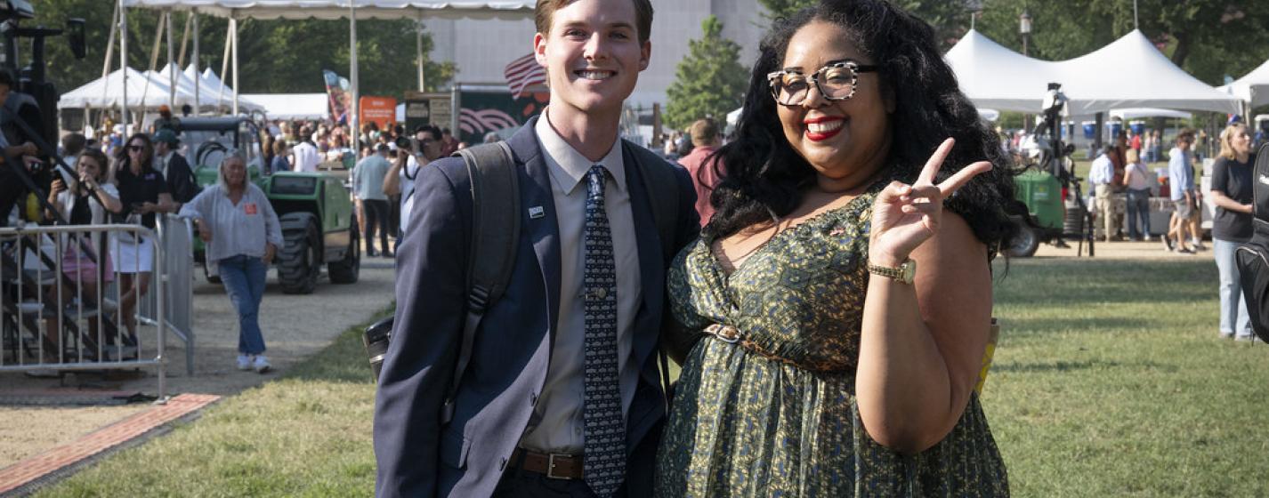 A man and woman smiling
