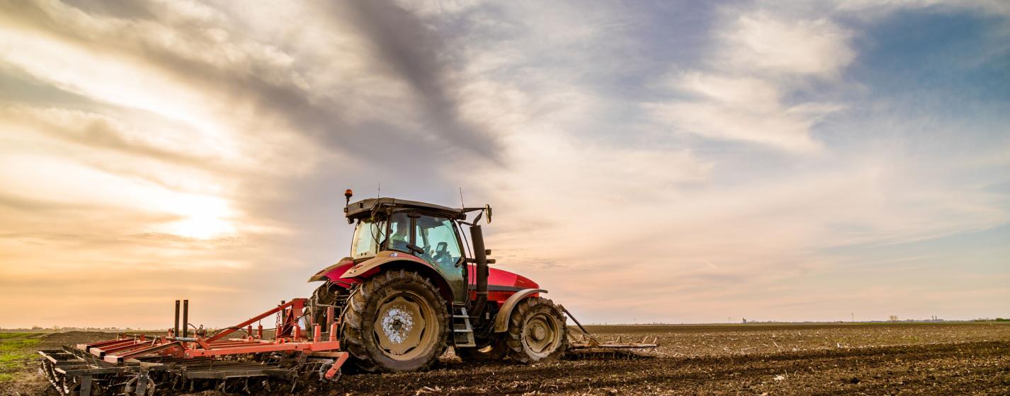 A tractor working on land