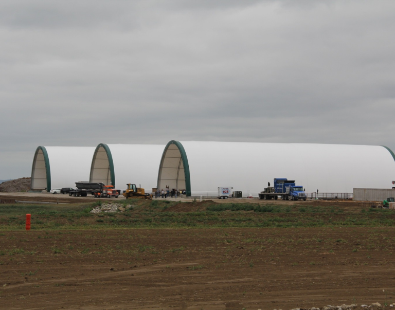 Three hoop buildings at a fertilizer facility
