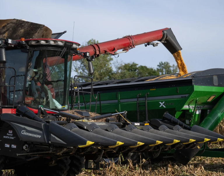 A tractor harvesting crops