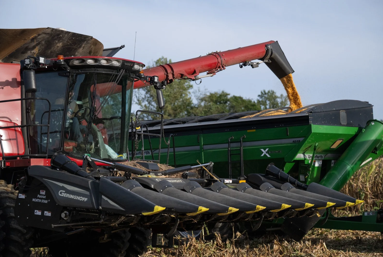 A tractor harvesting crops